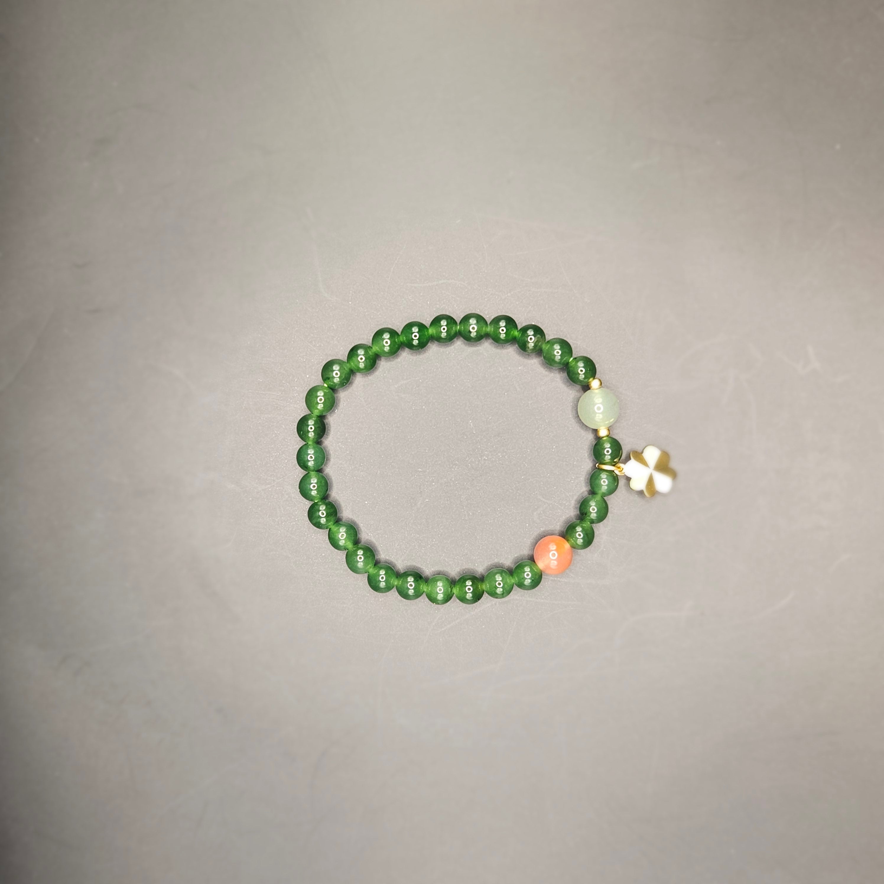 Siberian jasper Bracelet (Adorned with one Nanhong Agate bead and one pale "Clear Water" jade bead)