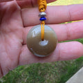 White and Caramel-Colored Nephrite Jade "Peace Buckle" Pendant