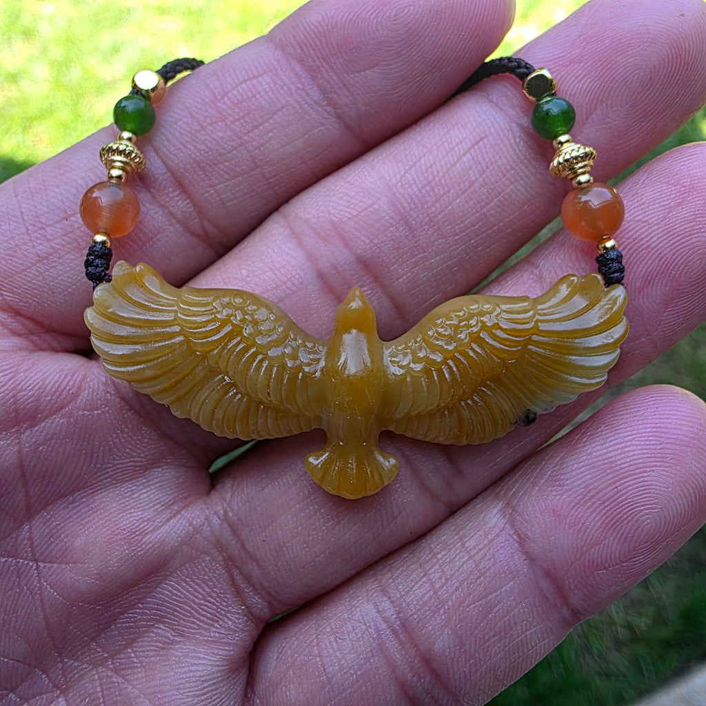 Nephrite jade pendant carved with a flying eagle