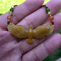 Nephrite jade pendant carved with a flying eagle