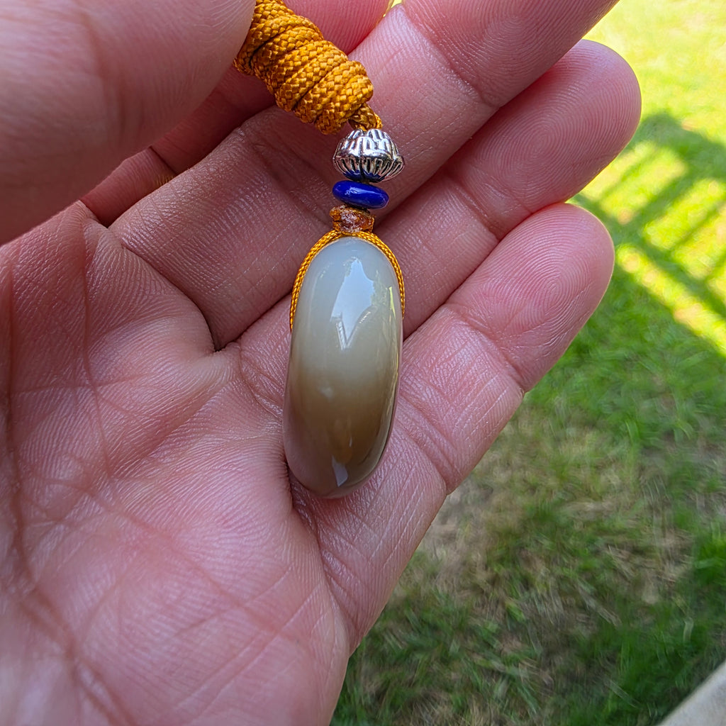 White and Caramel-Colored Nephrite Jade "Peace Buckle" Pendant