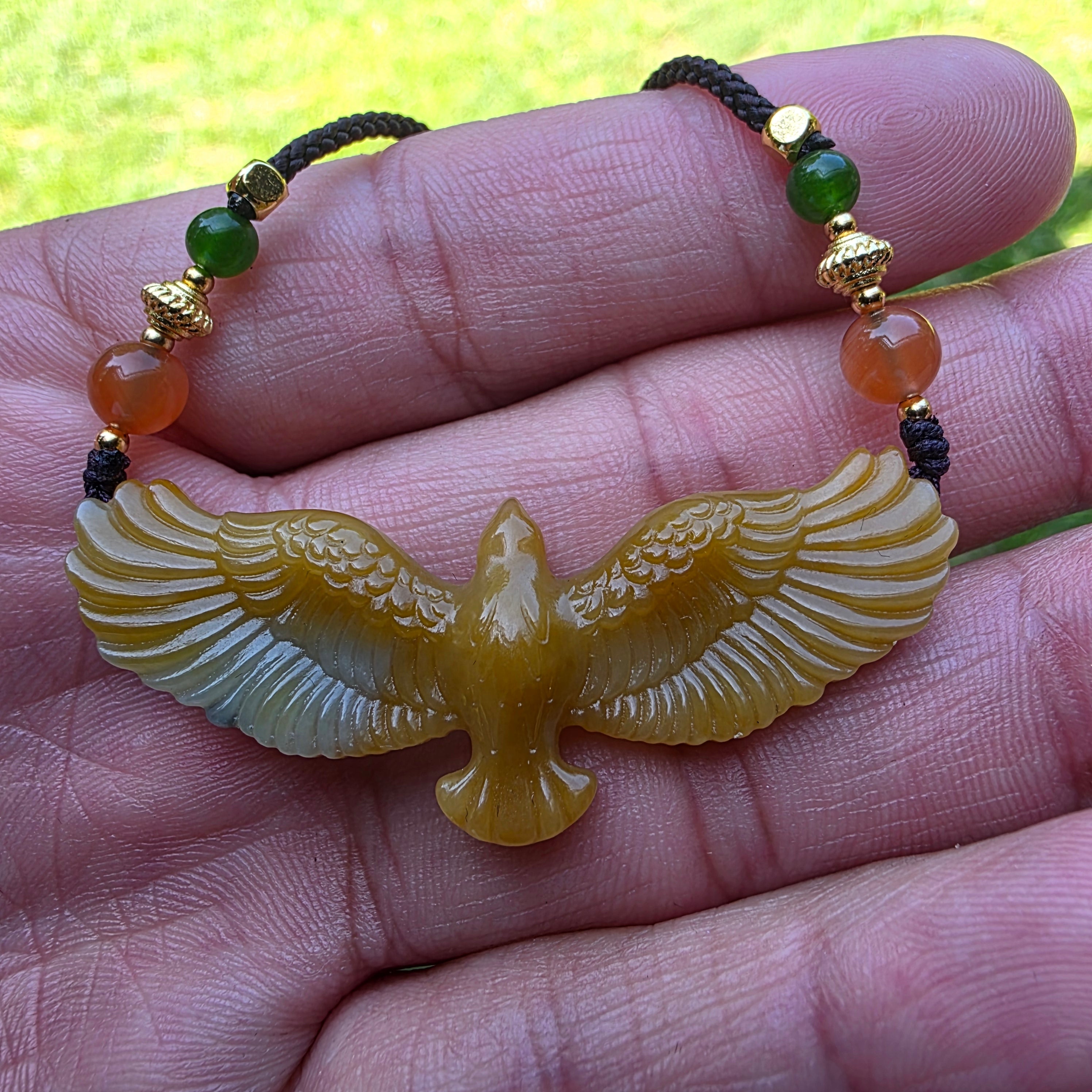 Nephrite jade pendant carved with a flying eagle